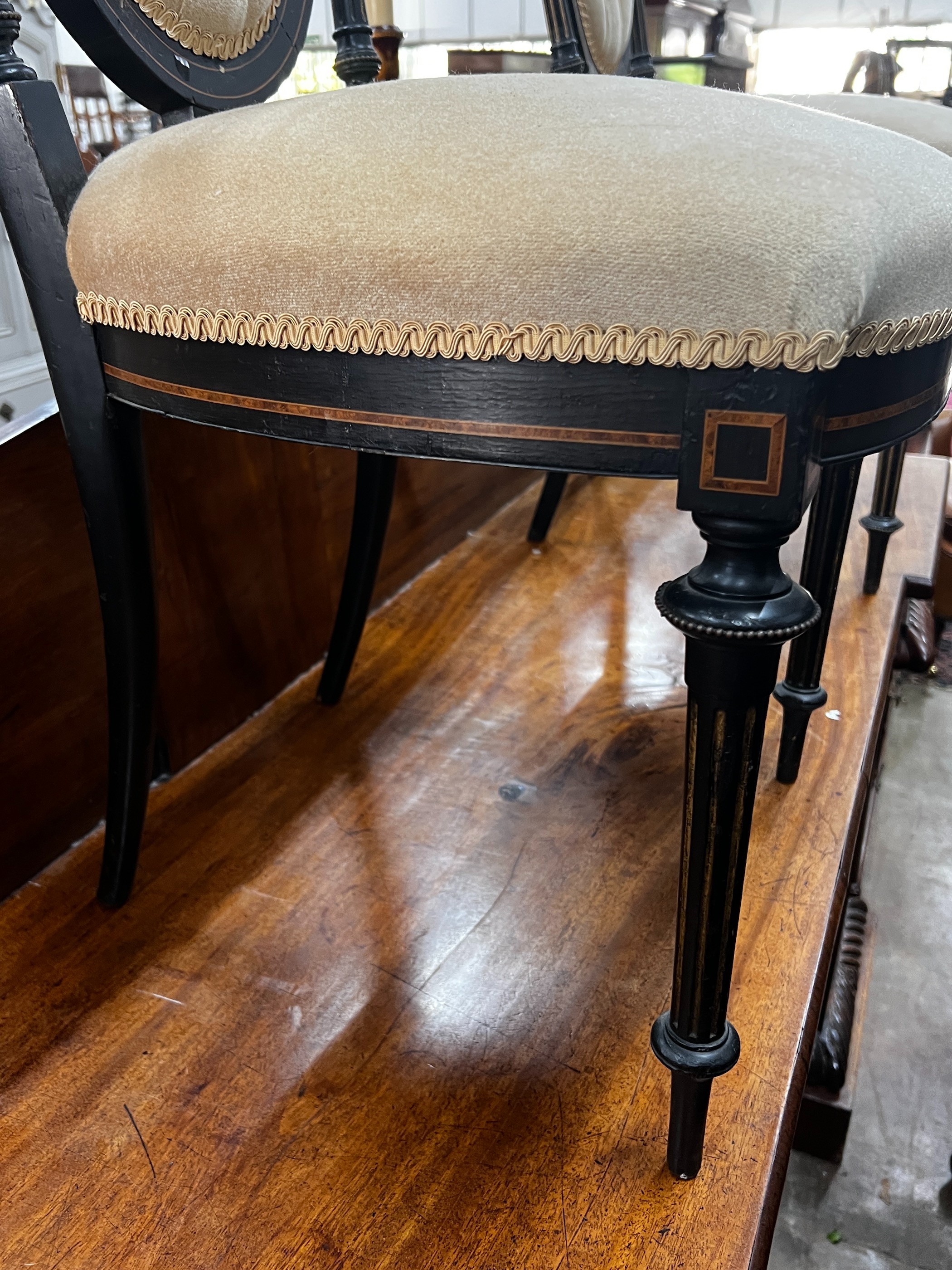 A pair of late Victorian ebonised side chairs